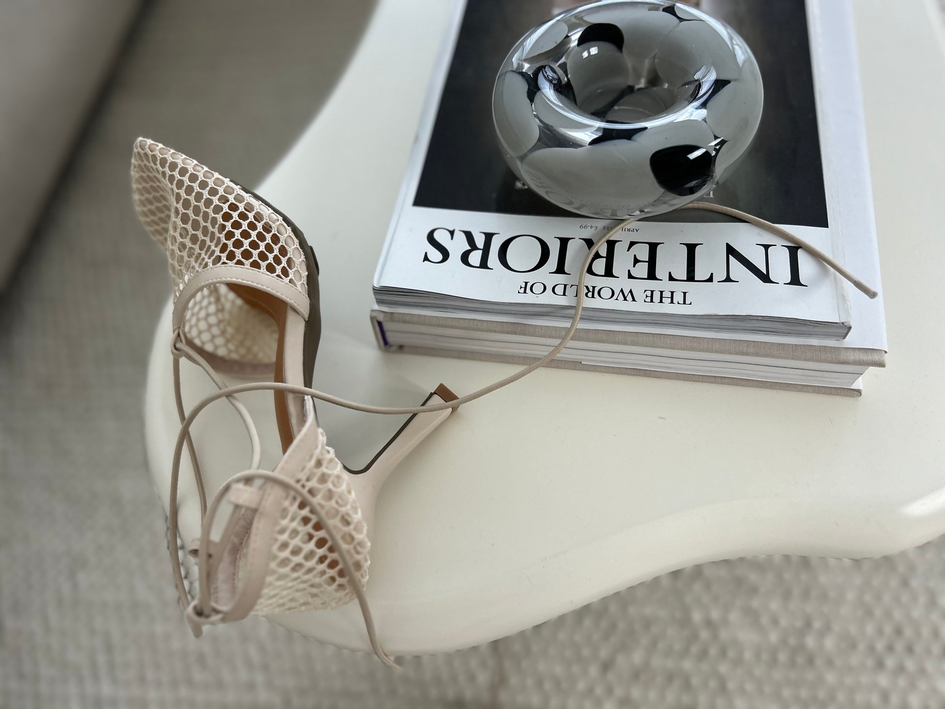 Close-up of trendy beige high heel sandals with see-through mesh and tie-up ankle straps, designed for modern women who love bold, elegant fashion – ideal for date nights, weddings, or luxury street style.