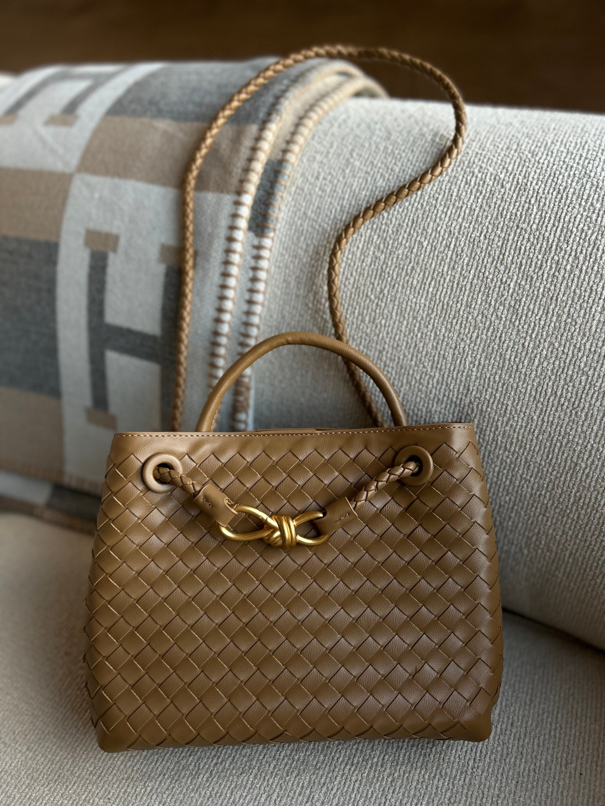 Close-up of woven vegan leather texture on mini luxury handbag