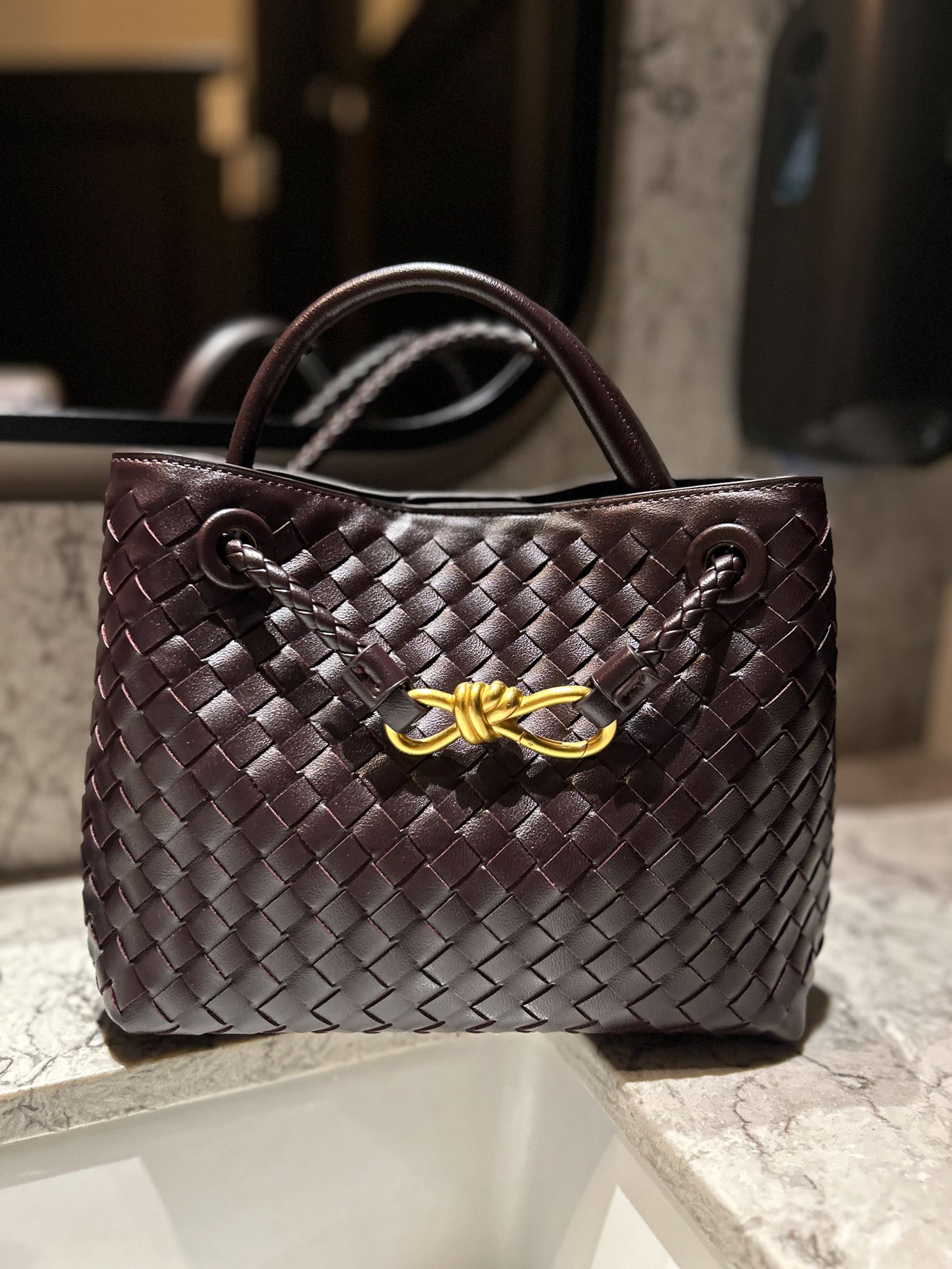 dupe designer inspired bag in coffee brown colour with red hues, made from vegan leather Stylish Hand Woven Hobo Tote, Elegant Handbag for everyday carry is Ideal Gift for wife, Woven braid bag with crossbody strap can be worn as shoulder bag too- practical and chic