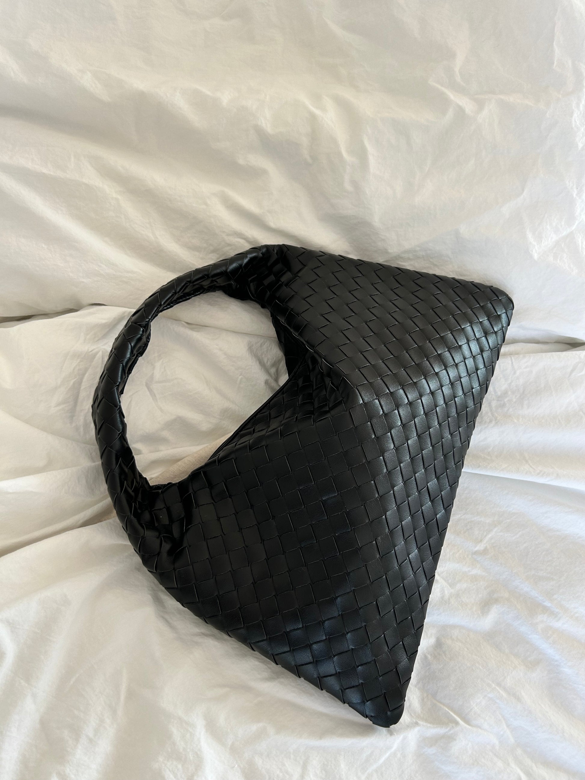 Elegant black shoulder bag with textured weave detail