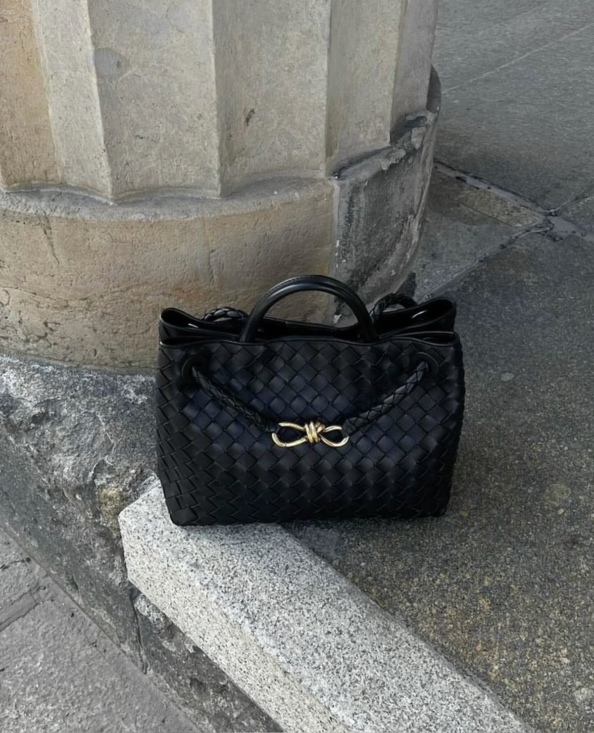 Elegant black vegan leather handbag with handwoven pattern and gold hardware, designer-inspired style by PattyB.