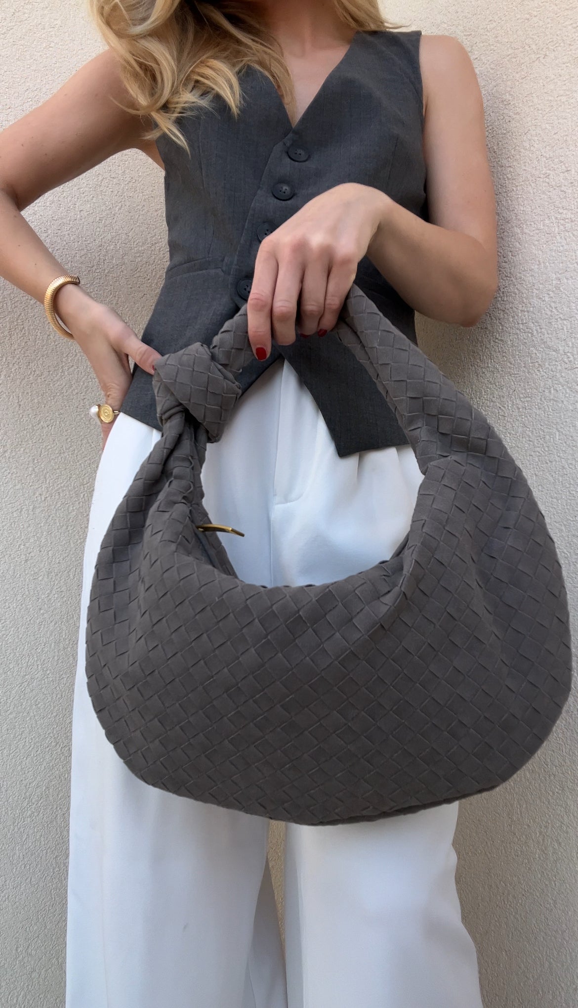 Elegant grey city bag with spacious interior and luxury-inspired woven detailing.