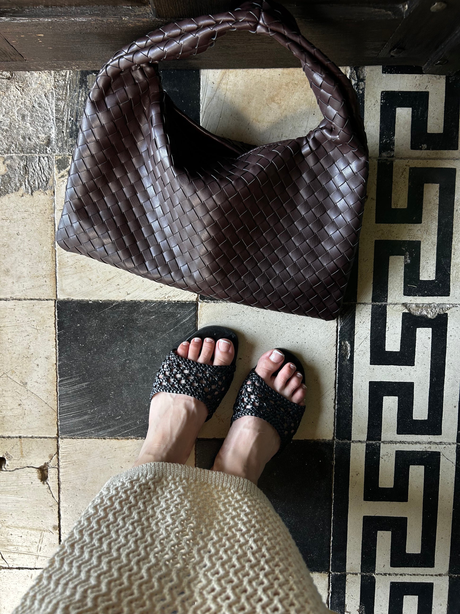 Elegant woven chocolate brown shoulder tote with gold-tone hardware, designed for everyday carry and effortless styling.