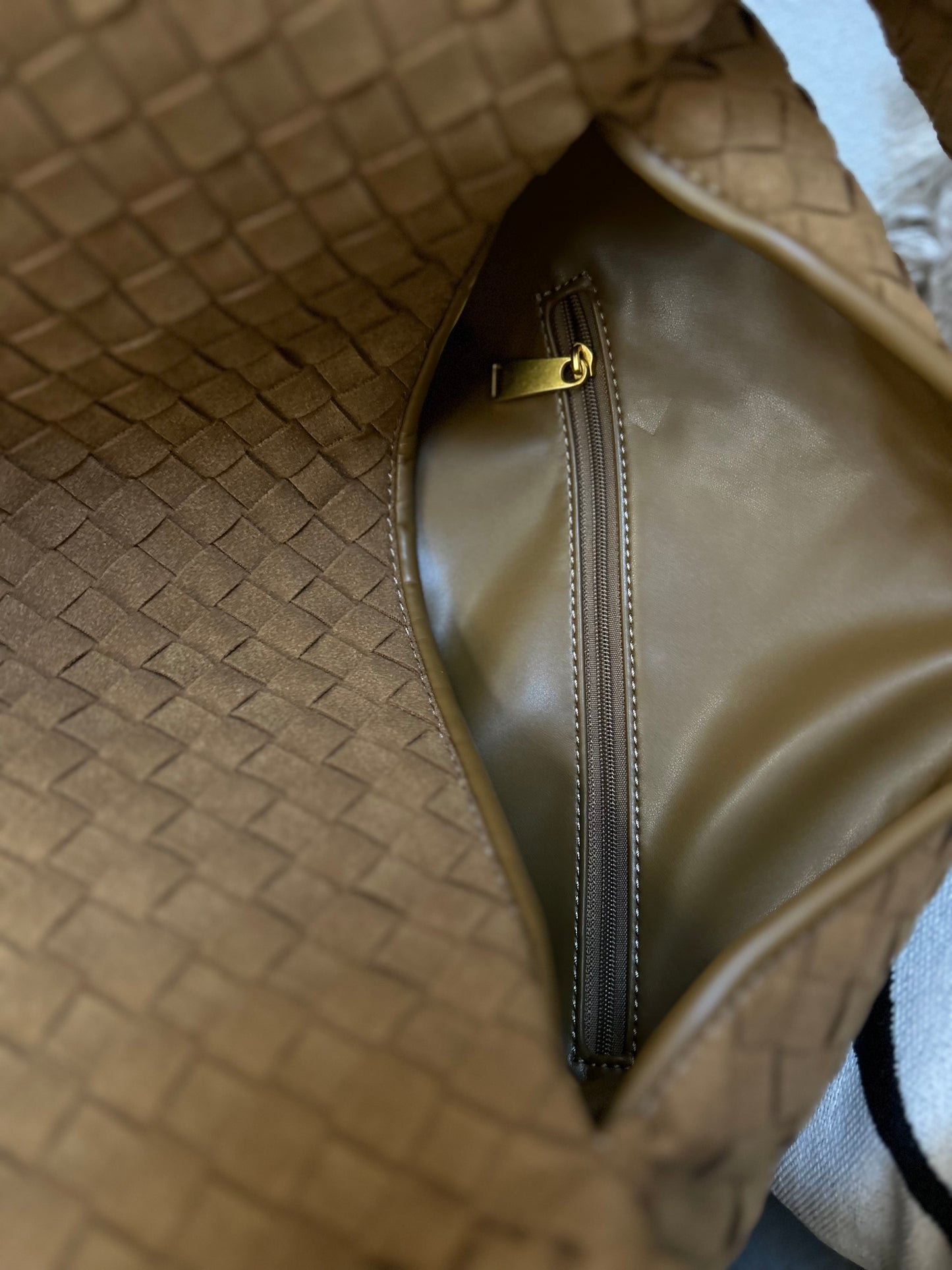 Extra large woven vegan suede tote bag interior detail with gold triangle zip