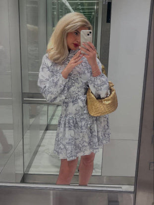 Gold woven mini handbag made from vegan leather, held by a woman wearing gold jewellery – perfect for stylish day-to-night outfits and eco-conscious fashion lovers.