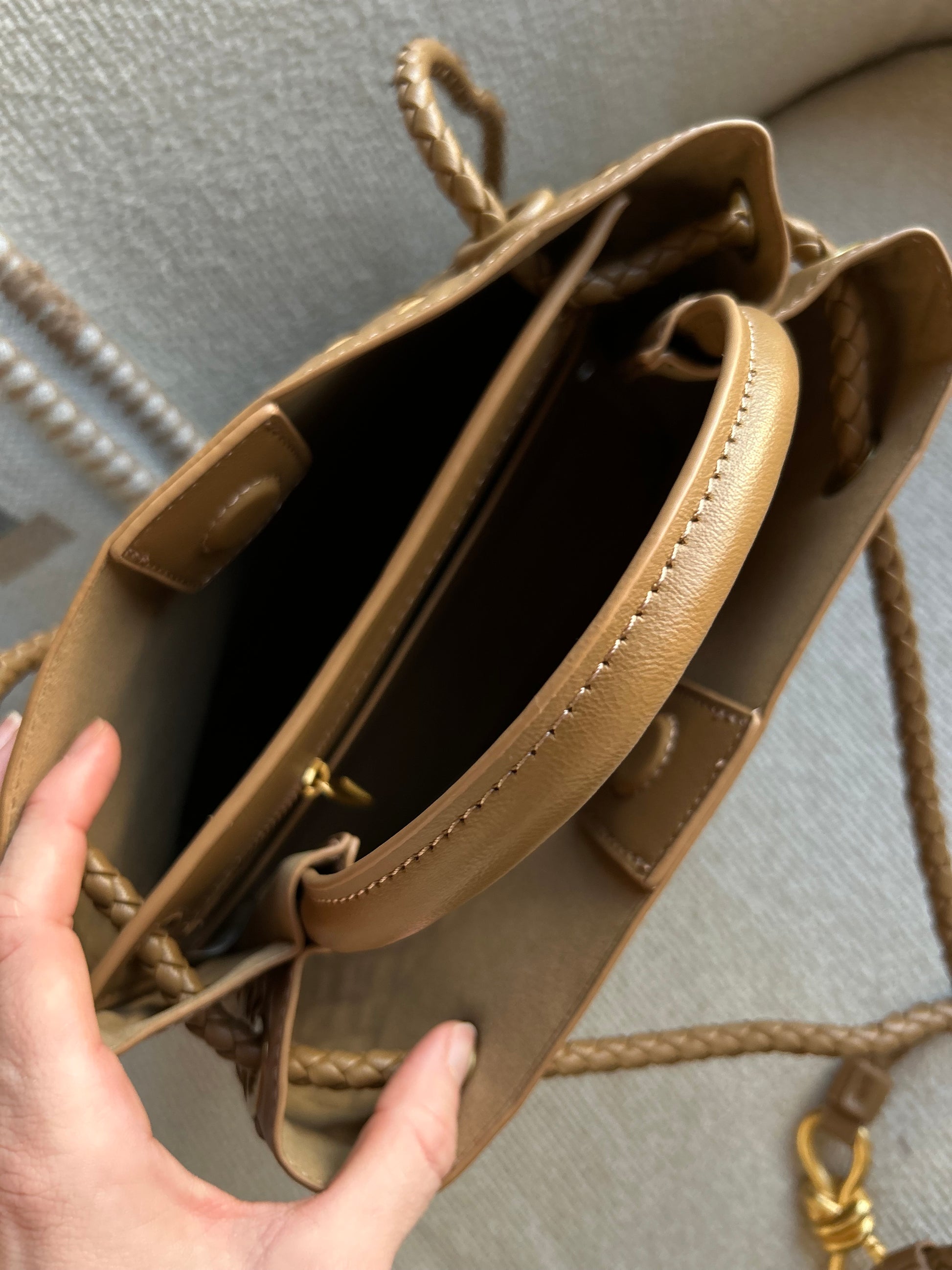 Interior view of woven mini handbag showing compartments and space