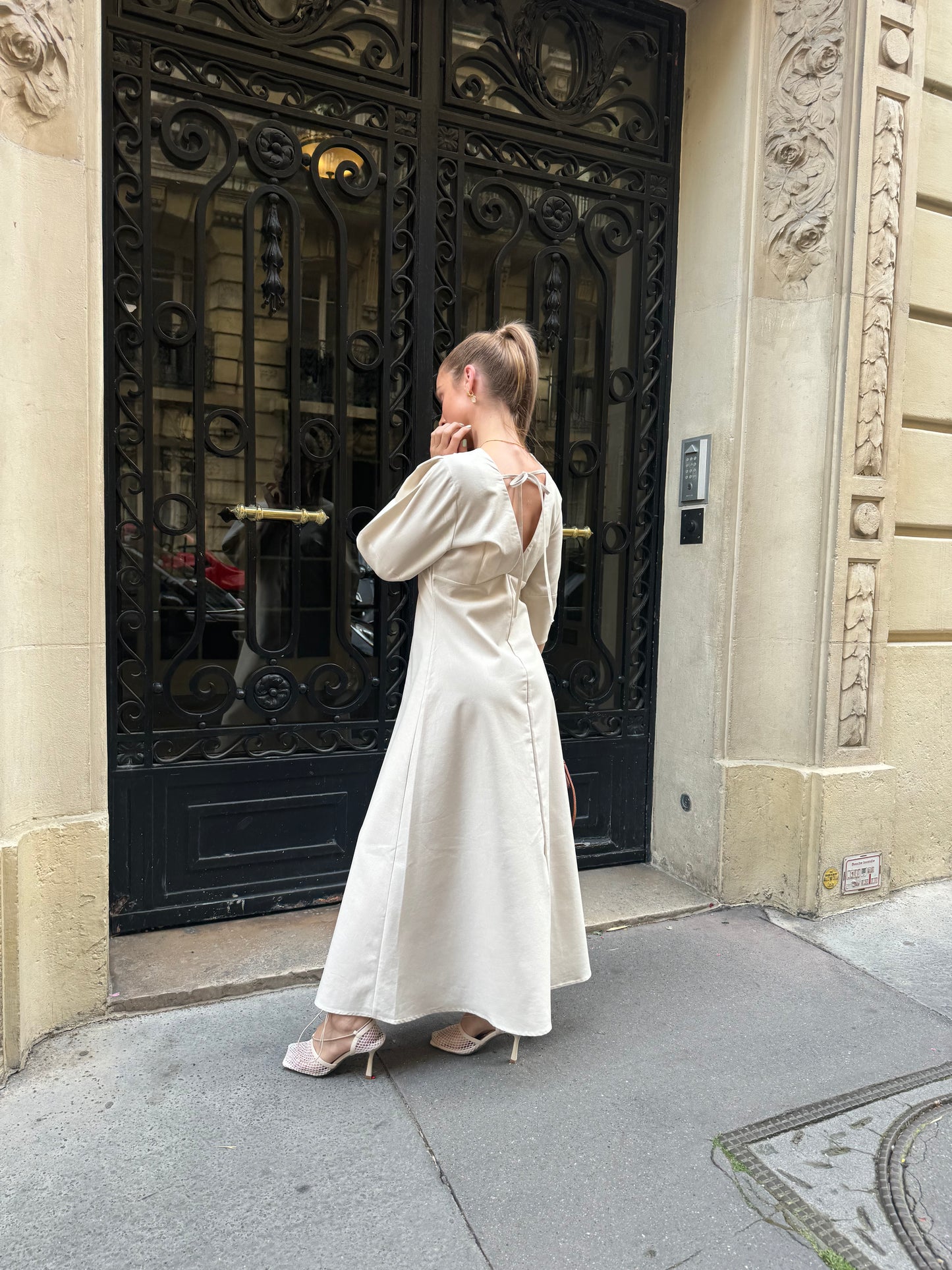 Minimalist summer midi dress styled with fishnet heels and neutral accessories