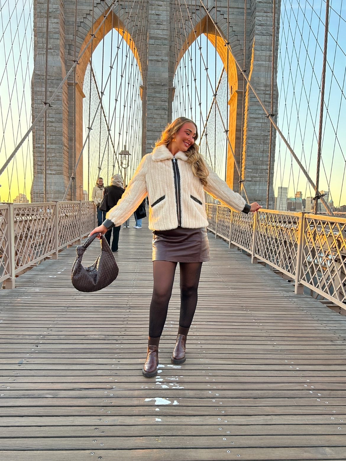 Minimalist woven brown handbag styled with blazer outfit