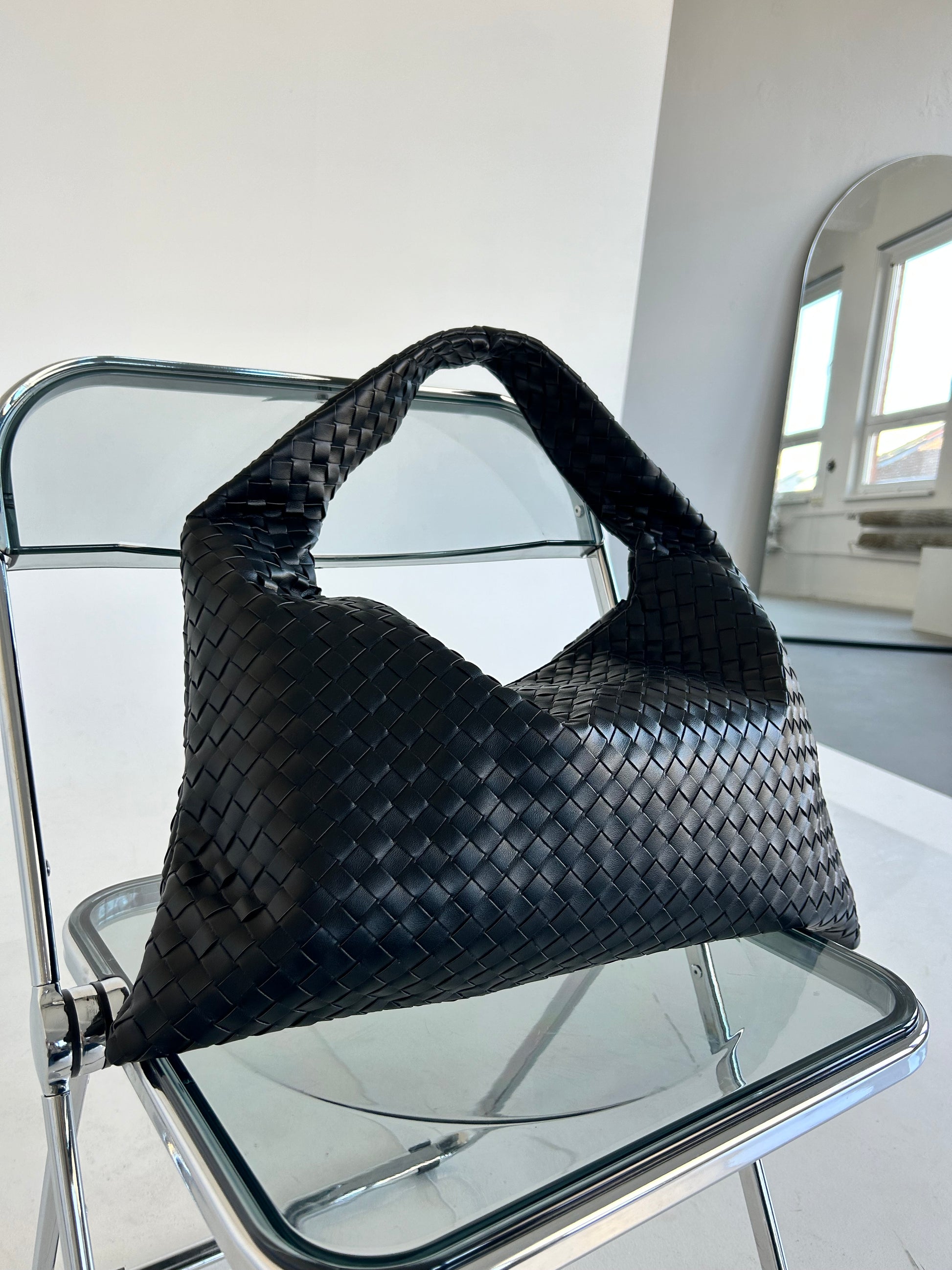 The Hobo Soft Leather Bag is the perfect blend of style, functionality, and comfort, making it an excellent choice for women who need a practical yet fashionable shoulder bag. Crafted from soft, premium leather, this bag features a beautiful woven design, adding a layer of texture and sophistication to its classic hobo shape. Its slouchy structure gives it a relaxed yet chic vibe, ideal for both everyday wear and special occasions.