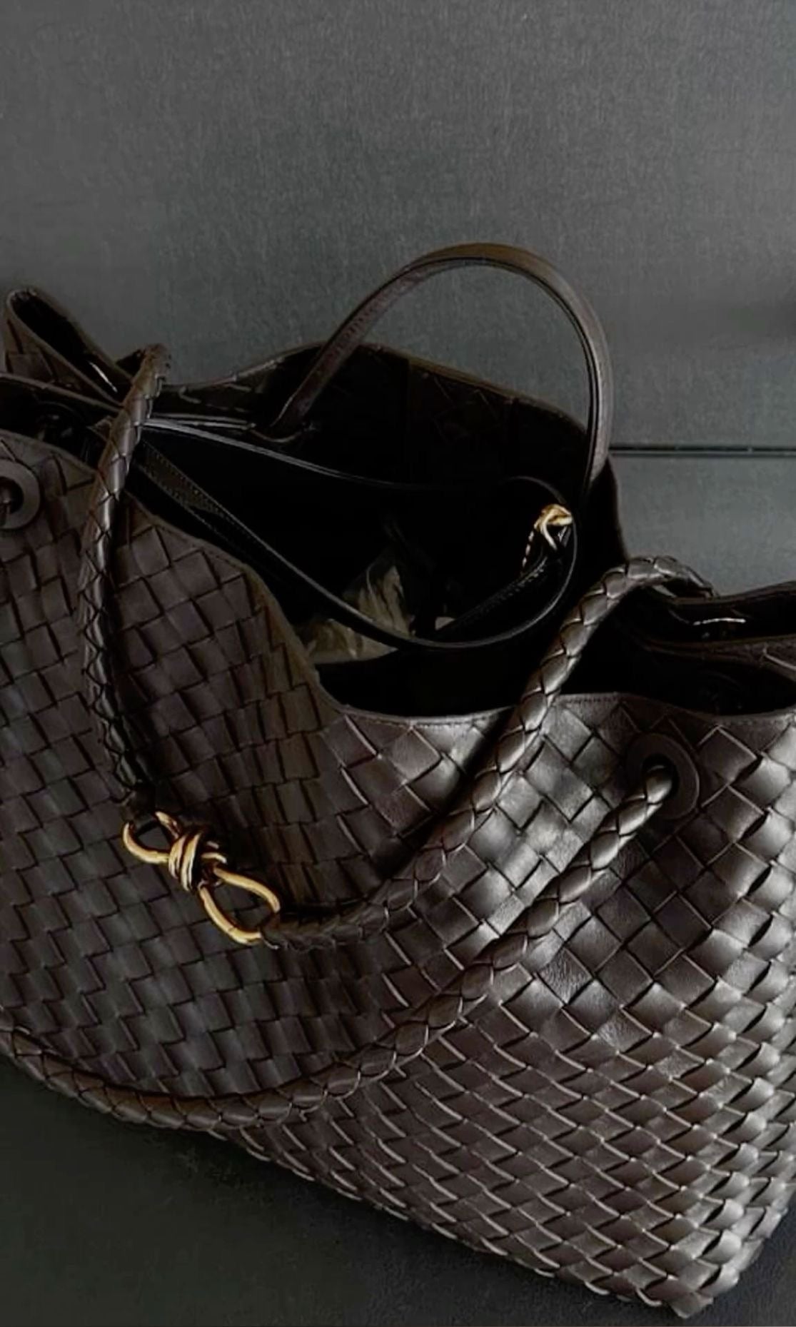 Spacious chocolate brown vegan leather purse displayed alongside everyday essentials.