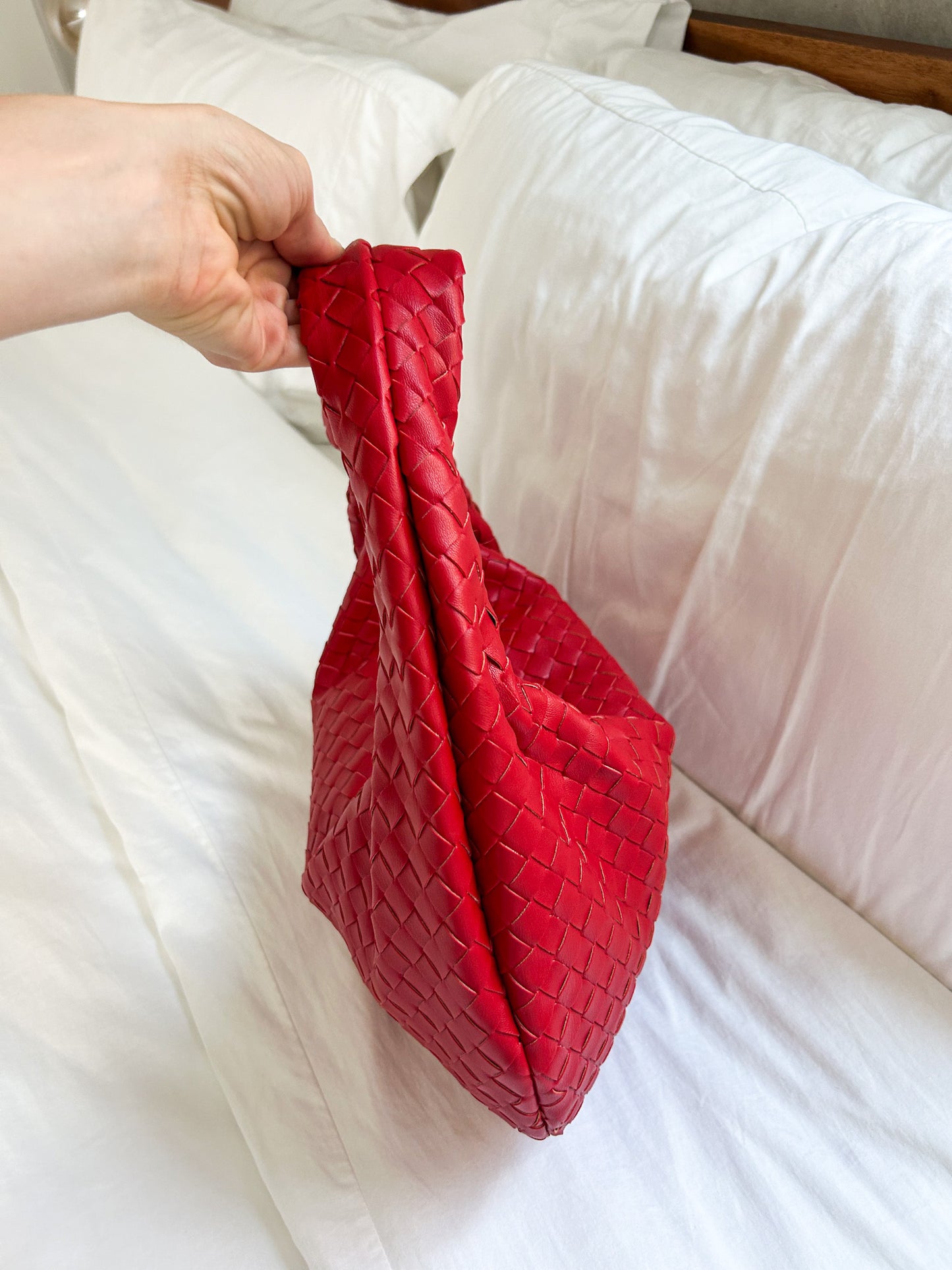 Statement red woven handbag perfect for summer outfits, vacations and everyday fashion.