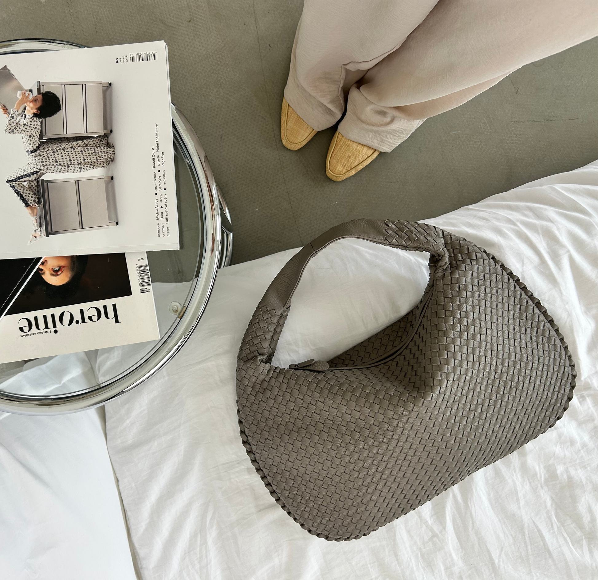 Taupe handbag styled with casual outfit and magazine