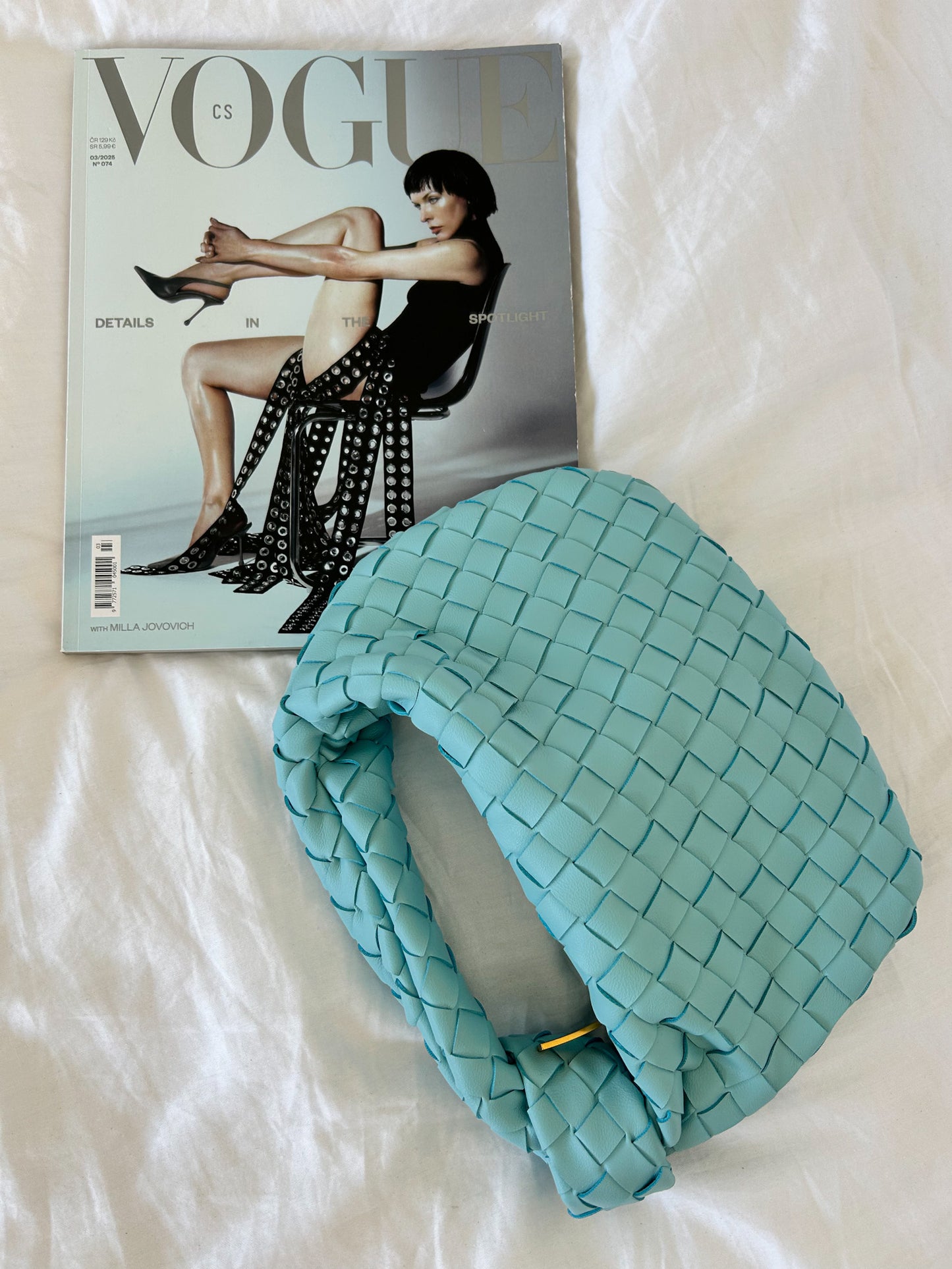 Timeless baby blue woven clutch with premium vegan leather, gold hardware and elegant minimalist styling.