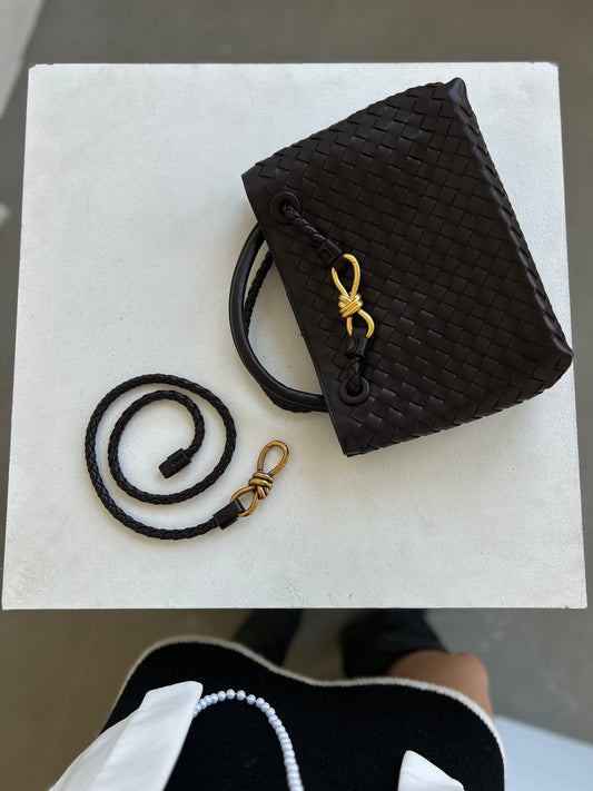 chocolate brown belt in handwoven design with visible braided detail to showcase premium craftsmanship. this designer inspired belt is made from premium vegan leather and available in size S,M and L. unique gold buckle detail. designer dupe belt