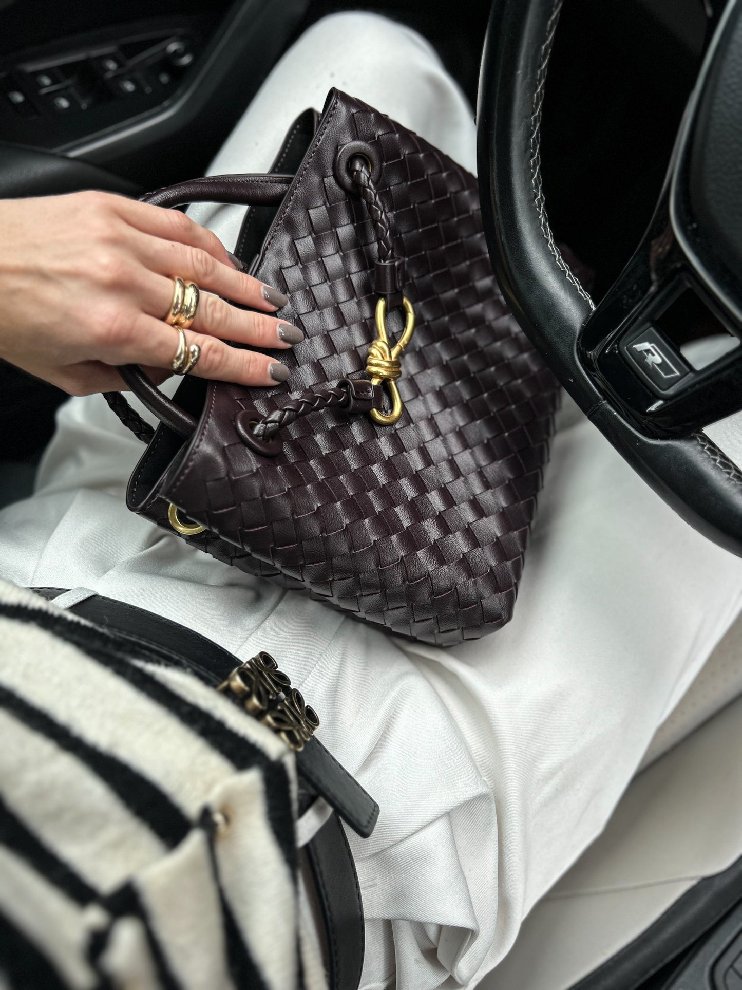 luxury designer inspired crossbody handbag in coffee colour with braided crossbody shoulder strap. chic vegan leather purse suitable for casual everyday wear as well as practical woven work bag. thoughtful Anniversary gift idea for wife.