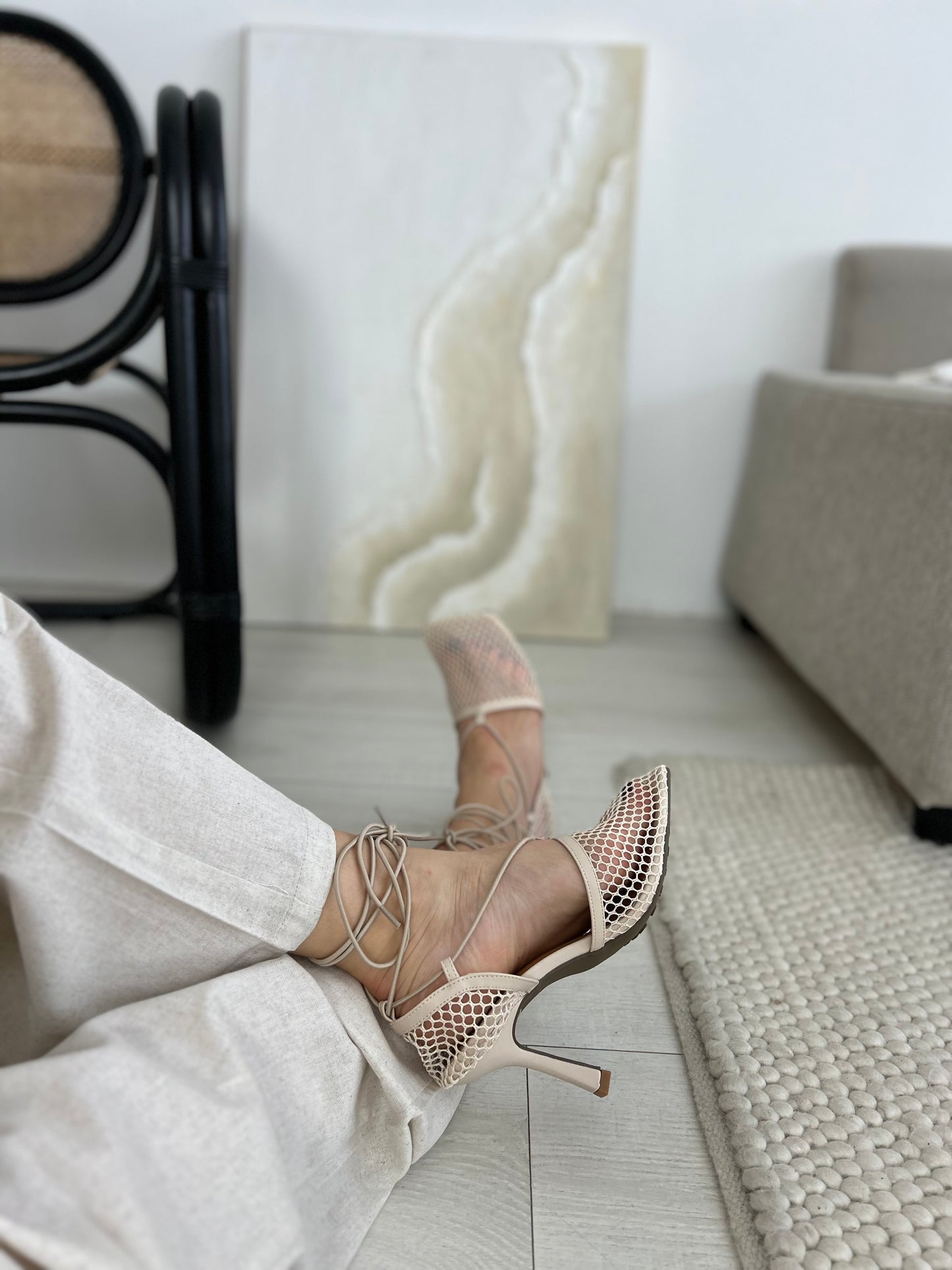 Statement beige heels with breathable mesh and delicate ankle straps seen in an urban setting – versatile shoes that transition from daytime meetings to evening occasions with effortless style.

Keywords: versatile heels for women, beige fashion sandals, breathable mesh high heels, statement shoes online