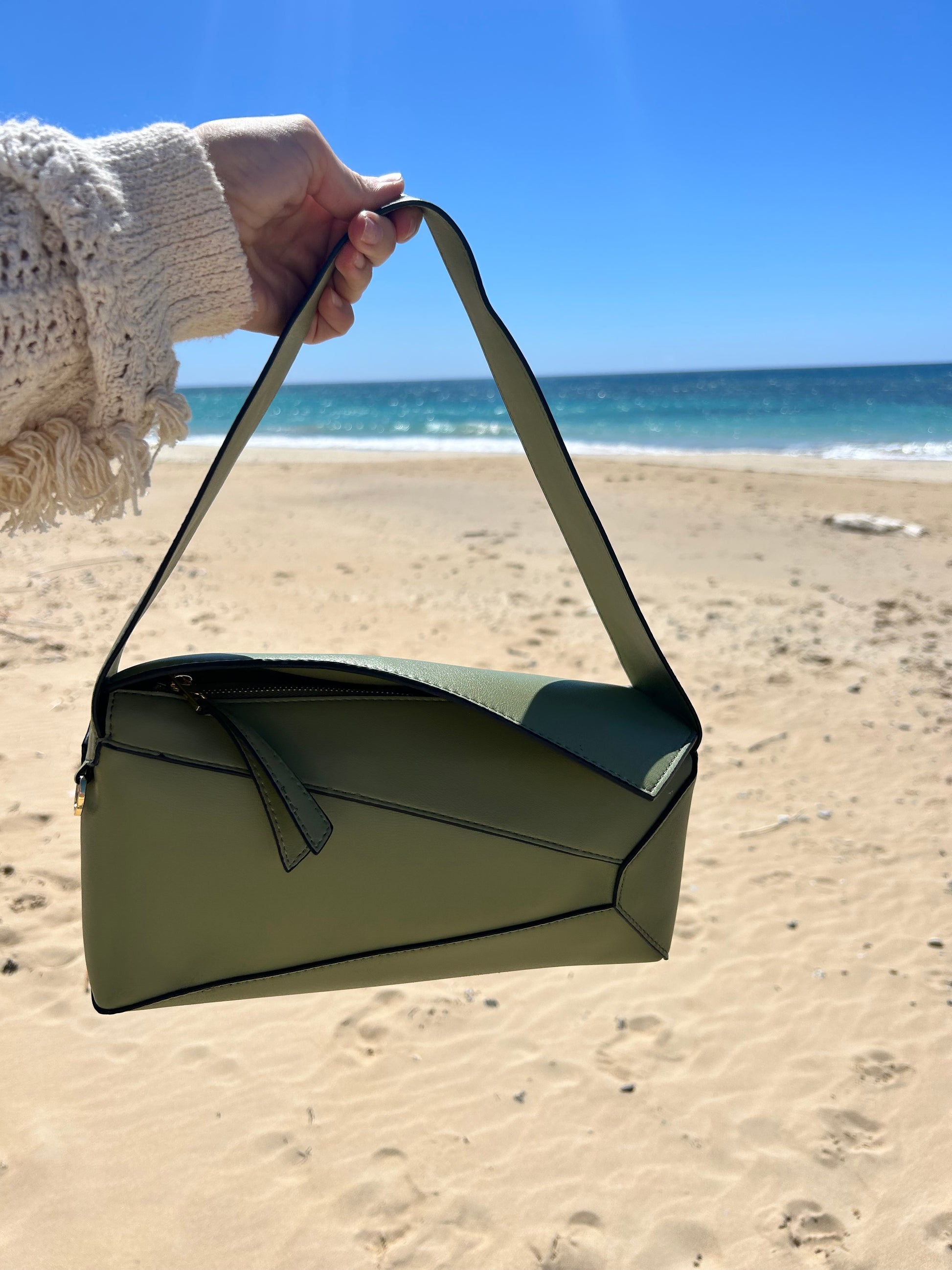 luxury designer inspired purse made from pieces of leather creating a puzzle effect