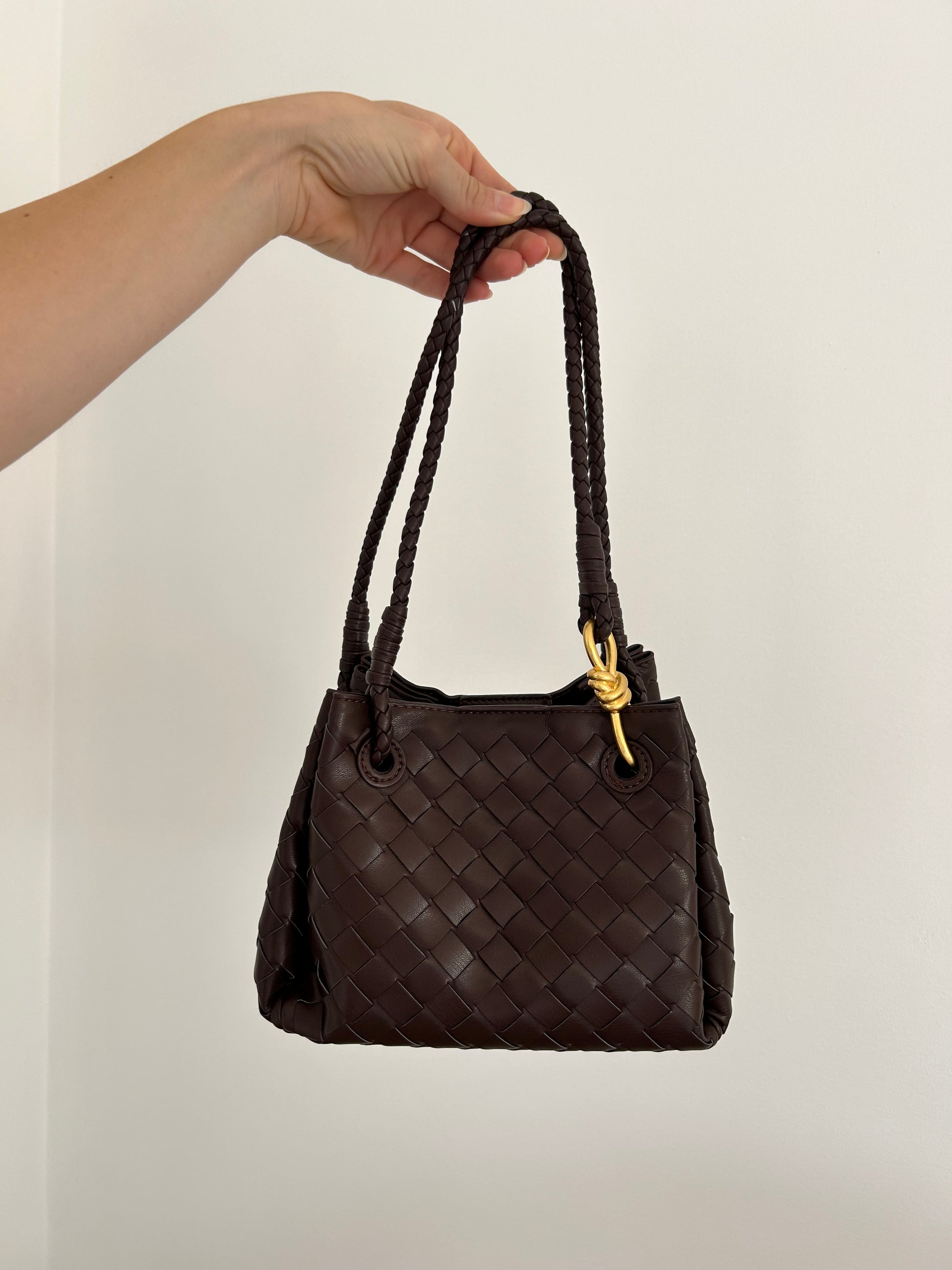 Elevate your style with our Dumpling Bag for Stylish Women! This chic accessory features a unique box top handle design that adds a modern touch to any outfit. Perfect for carrying your essentials in style, this bag is both fashionable and functional. Make a statement with this versatile piece that will surely turn heads wherever you go. Handcrafted with high-quality materials, this Dumpling Bag is a must-have addition to your accessories collection.