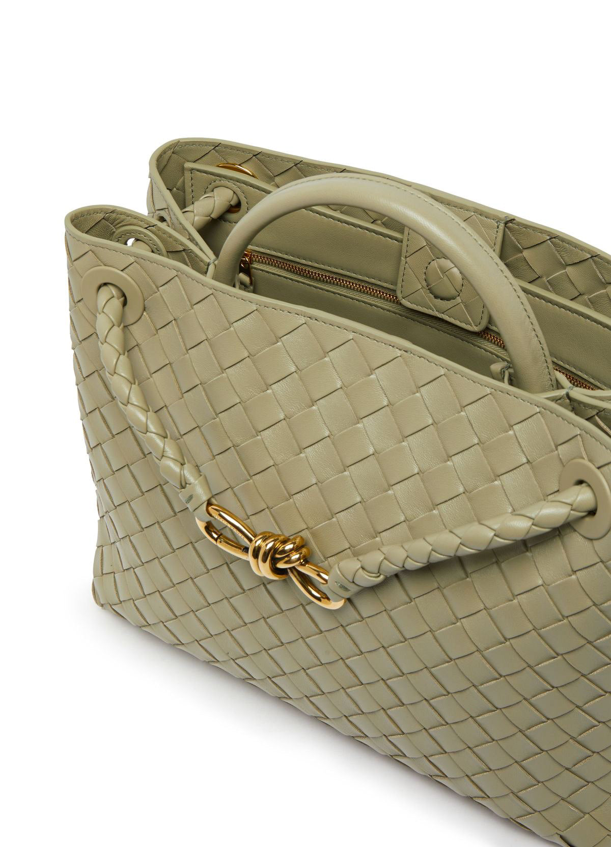 light green - sage-  woven handbag with a gold clasp on a white background