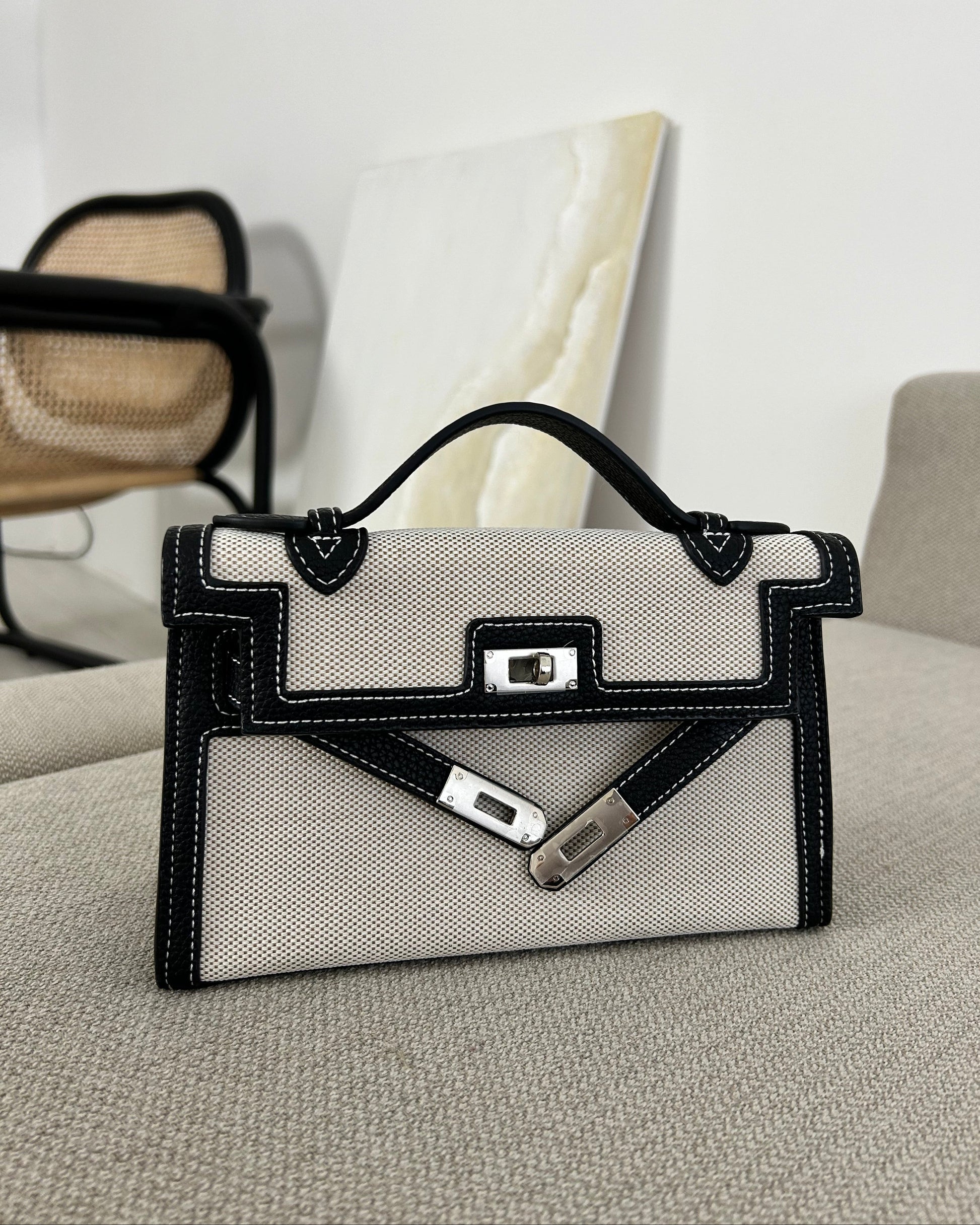 luxury canvas handbag, designer-inspired top handle bag, monochrome purse, structured women’s handbag, boss babe accessories, elegant fashion bag, statement handbag for women, classy black and white purse, stylish canvas tote alternative, modern minimalist bag
