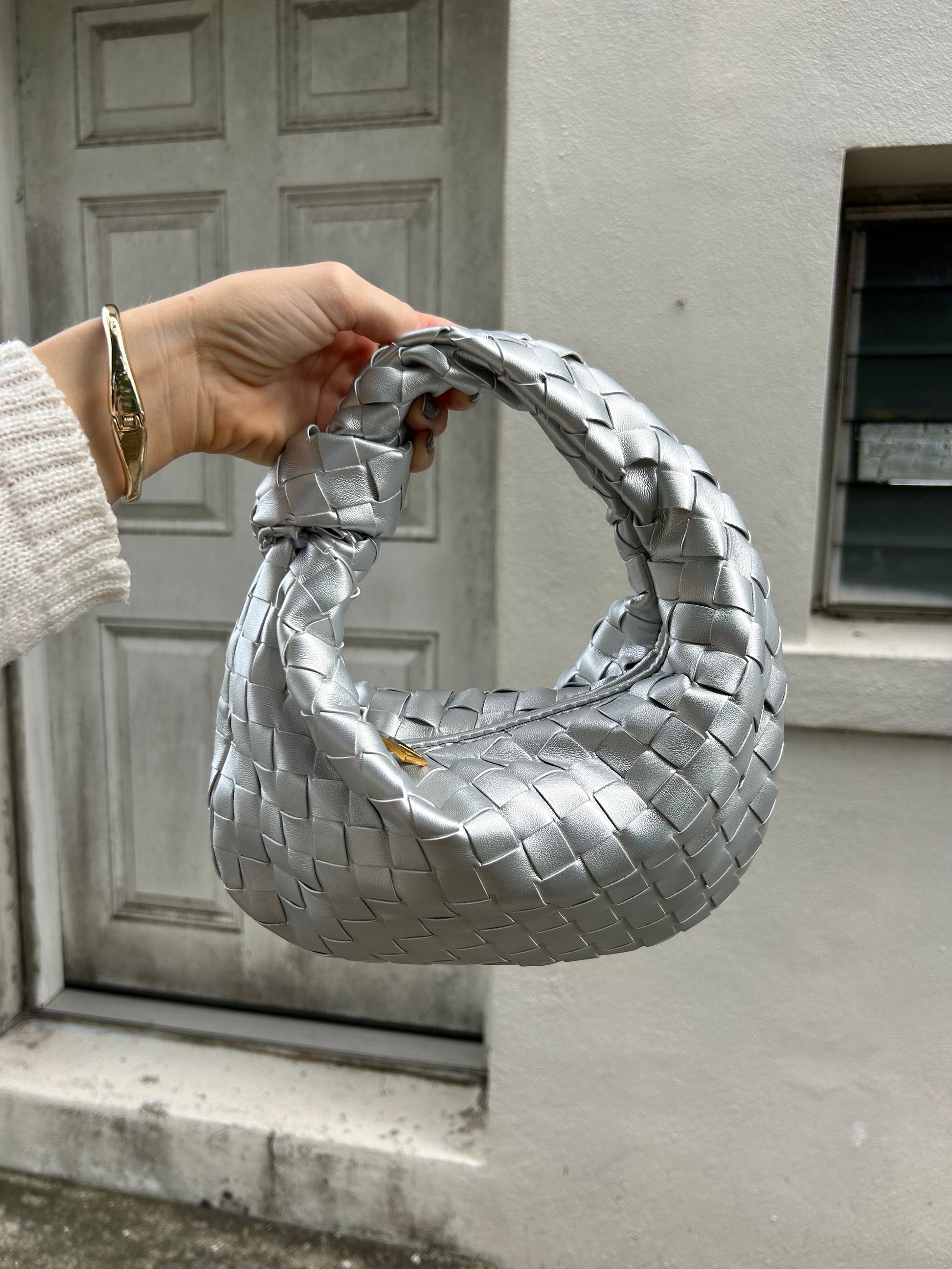 If you're looking for a stylish, high-quality accessory that blends fashion and function, the Special Occasion Woven Design Dumpling Clutch is your go-to option. Its eye-catching design, combined with practicality, makes it a must-have for any woman who wants to add a touch of elegance to her ensemble.