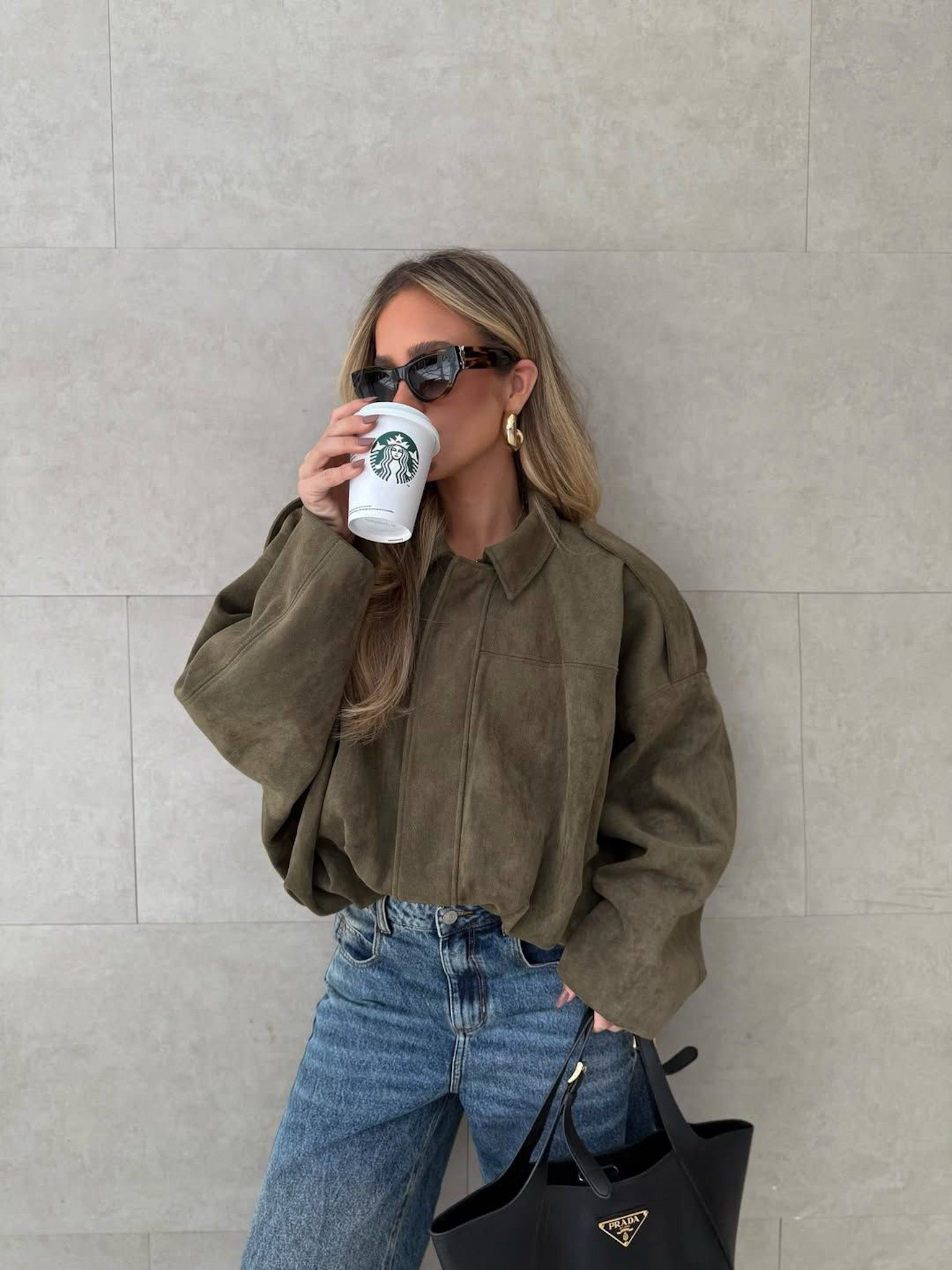 oversized bomber jacket suede effect styled with jeans spring outfit