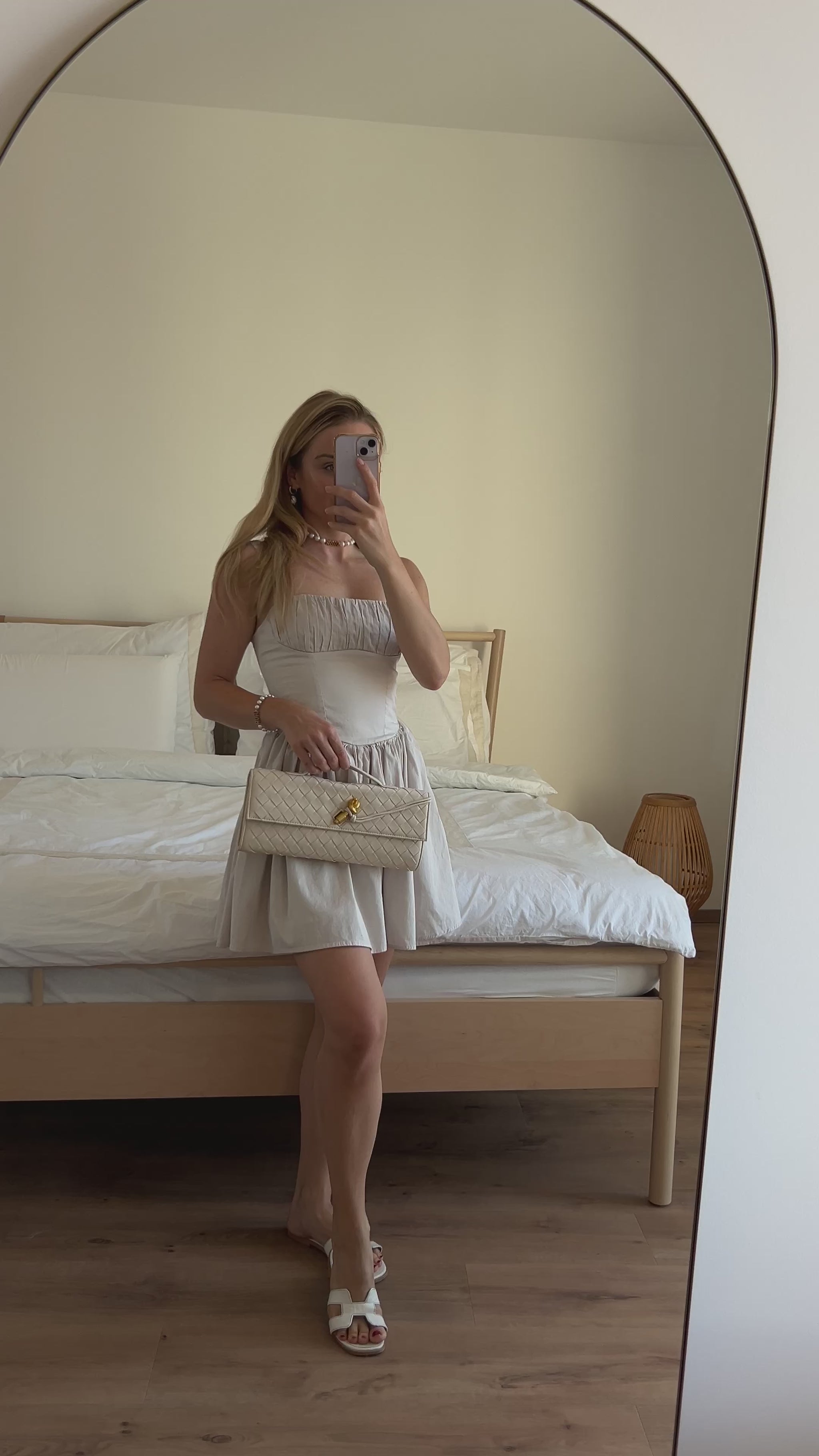 Women's cream vegan leather clutch for capsule wardrobe styling