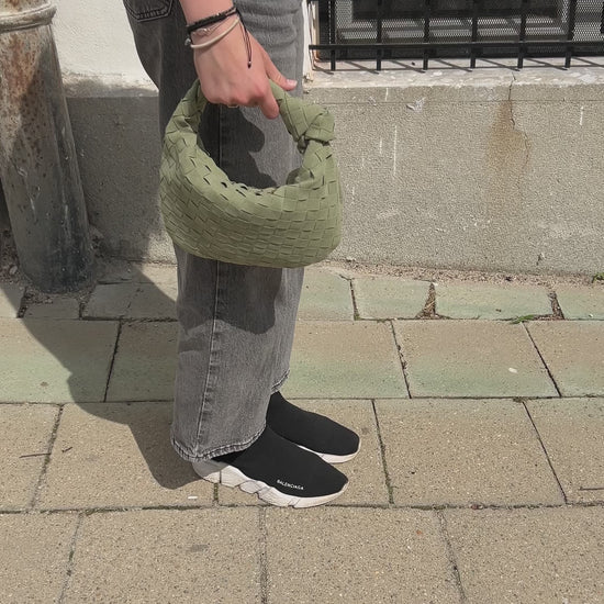 minimalist sage green clutch summer outfit inspiration, girl walking the street in Mikulov