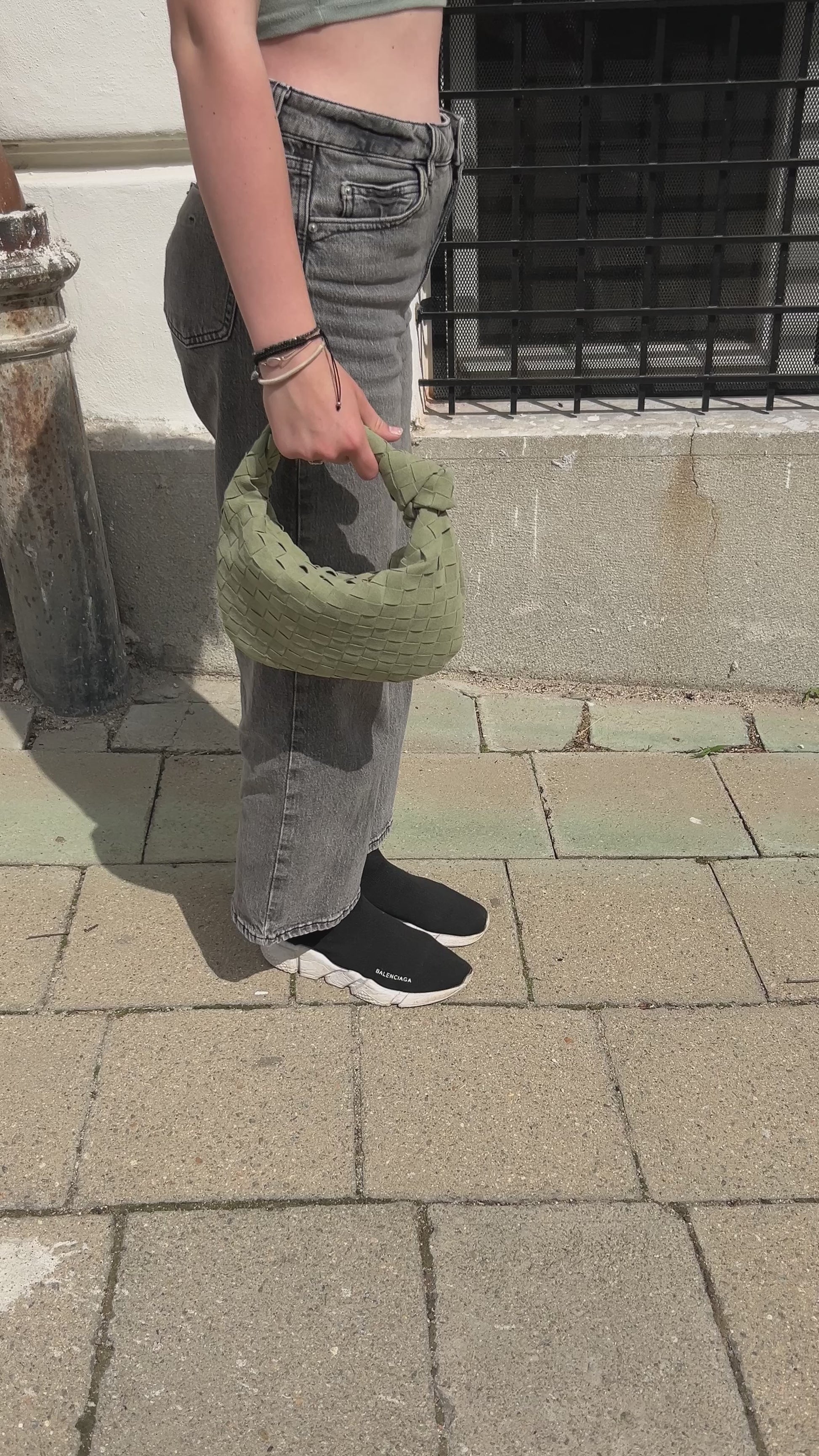 minimalist sage green clutch summer outfit inspiration, girl walking the street in Mikulov