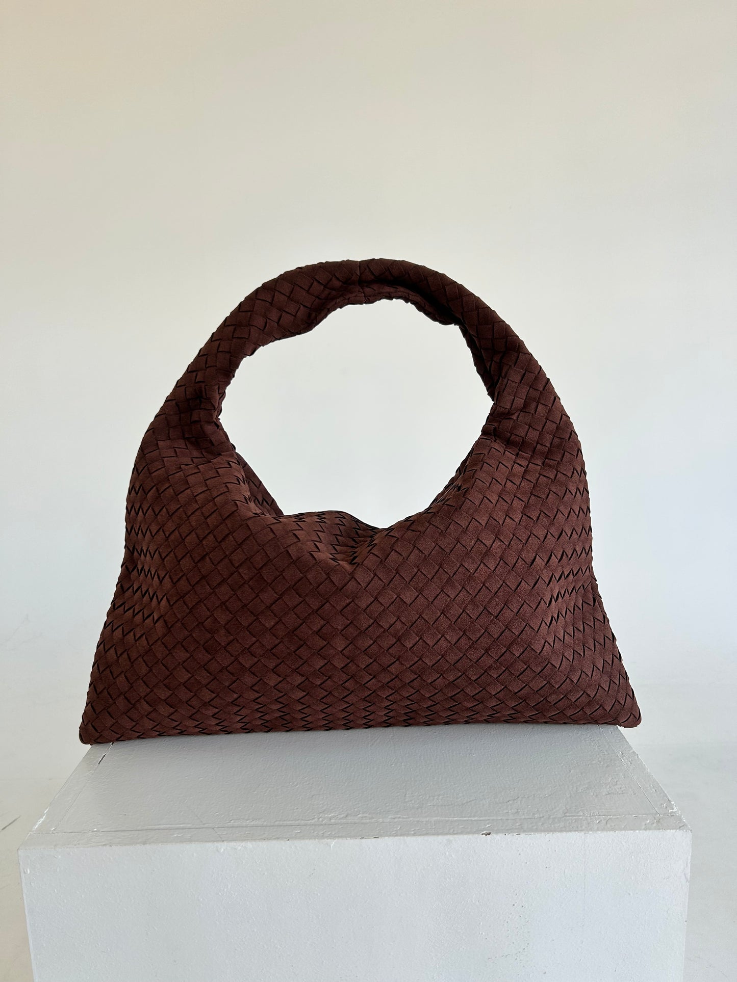 The Hobo Soft Leather Bag is the perfect blend of style, functionality, and comfort, making it an excellent choice for women who need a practical yet fashionable shoulder bag. Crafted from soft, premium leather, this bag features a beautiful woven design, adding a layer of texture and sophistication to its classic hobo shape. Its slouchy structure gives it a relaxed yet chic vibe, ideal for both everyday wear and special occasions.