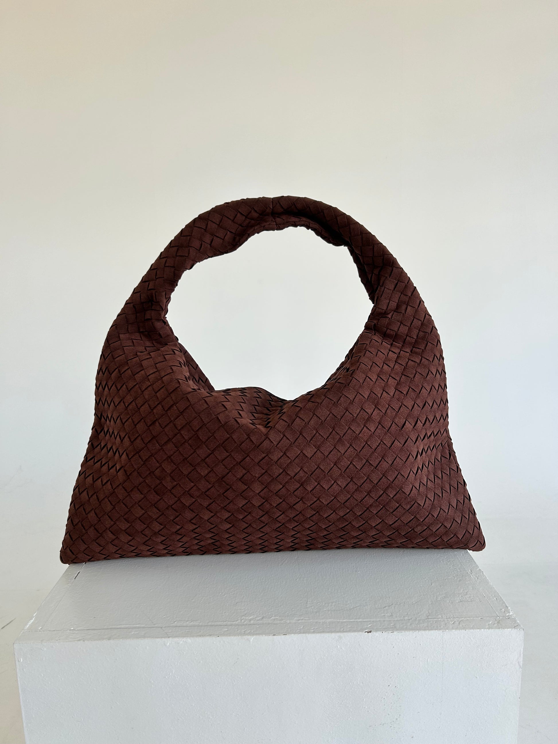 The Hobo Soft Leather Bag is the perfect blend of style, functionality, and comfort, making it an excellent choice for women who need a practical yet fashionable shoulder bag. Crafted from soft, premium leather, this bag features a beautiful woven design, adding a layer of texture and sophistication to its classic hobo shape. Its slouchy structure gives it a relaxed yet chic vibe, ideal for both everyday wear and special occasions.