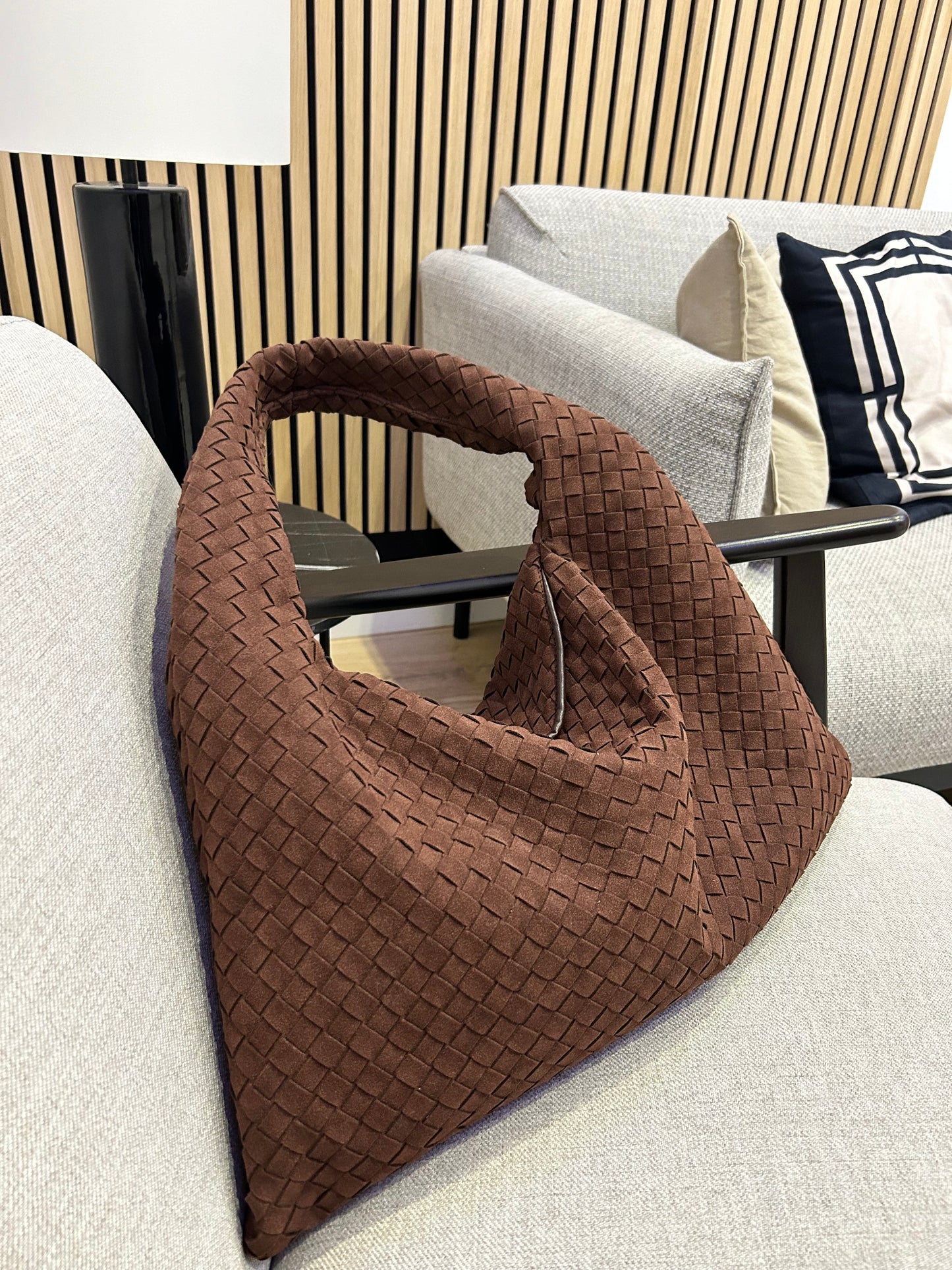 This chocolate-brown woven suede bag, crafted from vegan leather, features designer-inspired braided design.perfect Xmas gift, it combines style and function as work or travel bag with spacious interior and chic look,making it ideal for everyday wear