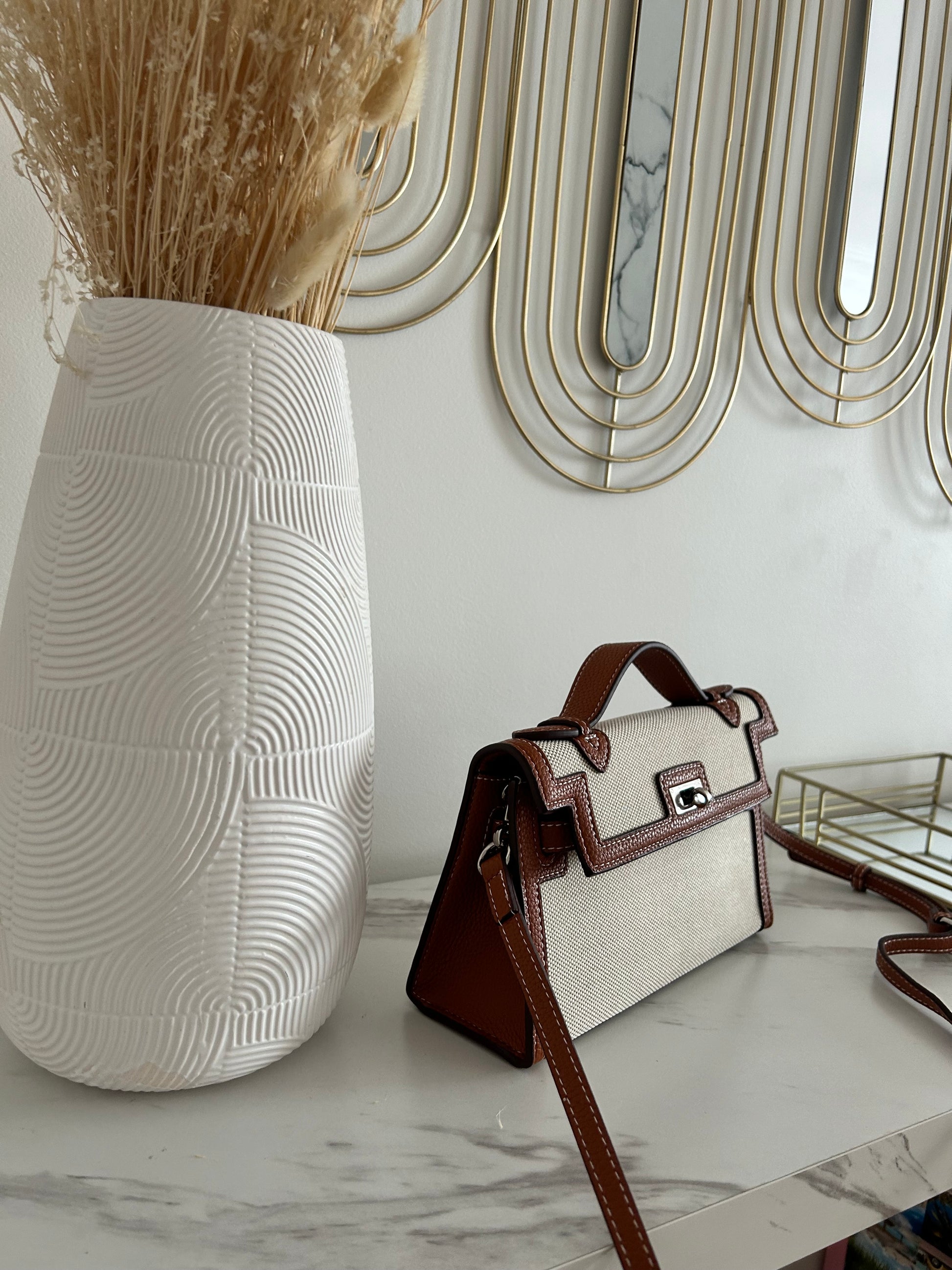 luxury canvas handbag, designer-inspired top handle bag, monochrome purse, structured women's handbag, boss babe accessories, elegant fashion bag, statement handbag for women, classy black and white purse, stylish canvas tote alternative, modern minimalist bag