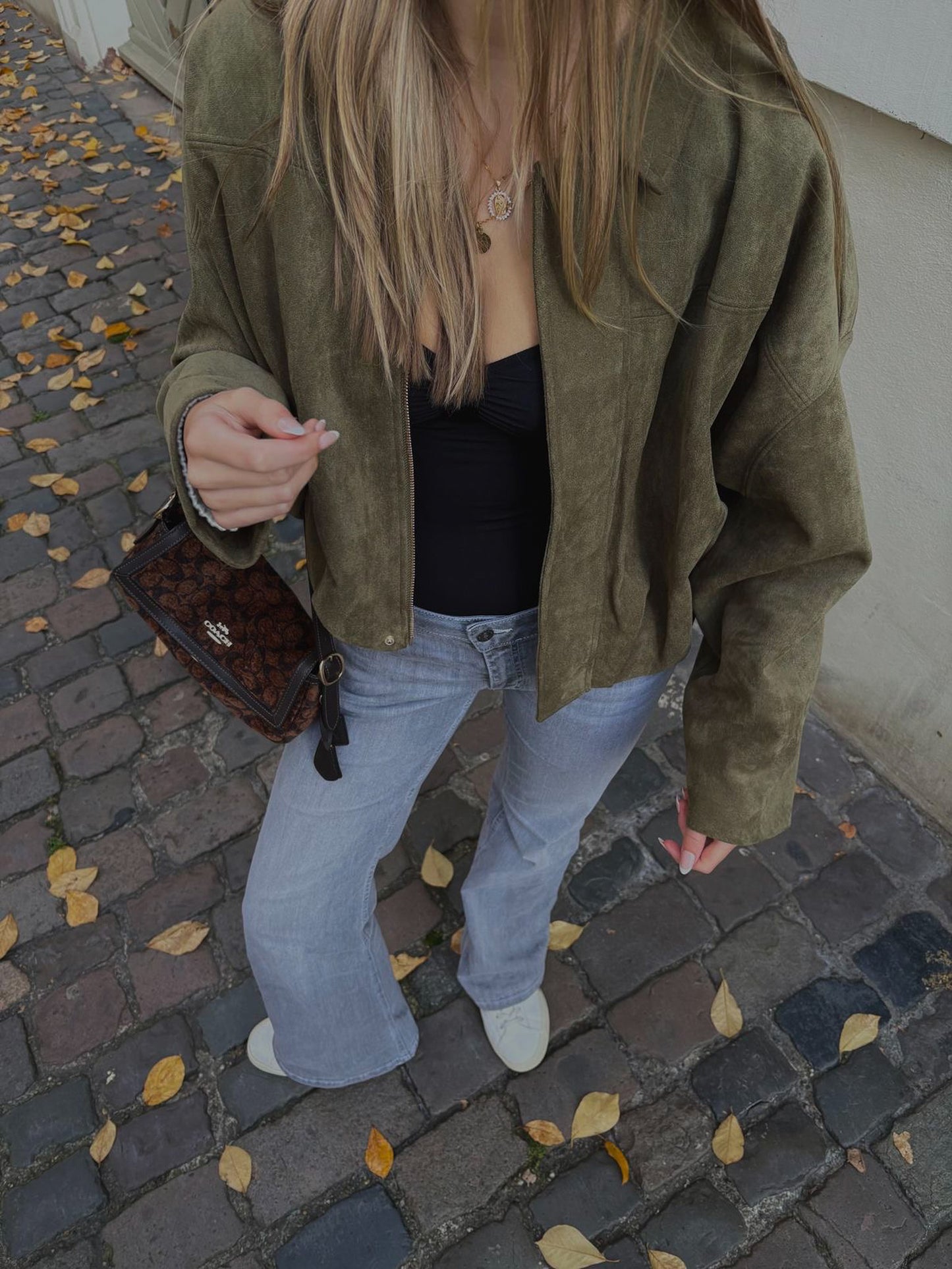 viral spring jacket outfit with black handbag brunch look
